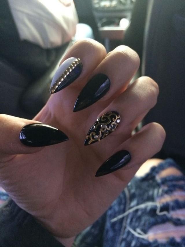 gold and black pointy nails