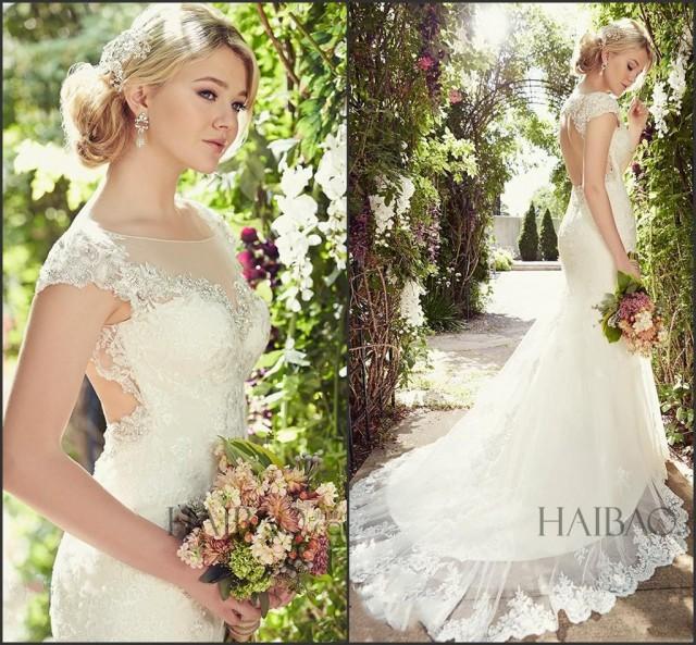 A bride in a gorgeous beaded lace mermaid wedding dress