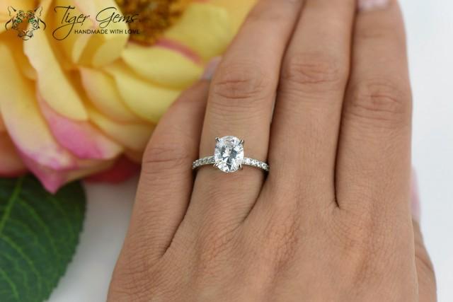 ring with two simple wedding bands and a solitaire in between